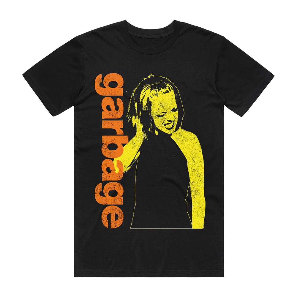Official Garbage Merchandise. 100% black cotton t-shirt with a vintage photo of Shirley Manson on the front in yellow and an orange Garbage logo.
