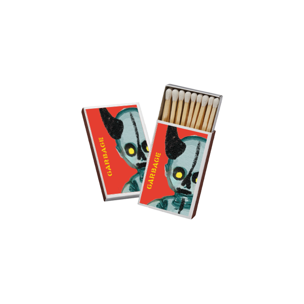 Matchboxes featuring a stylized alien or creature design on the cover.