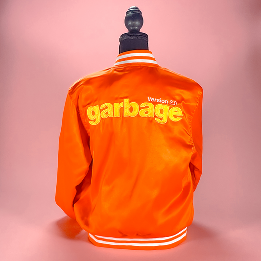 Bright orange jacket with ’garbage Version 2.0’ printed on the back.