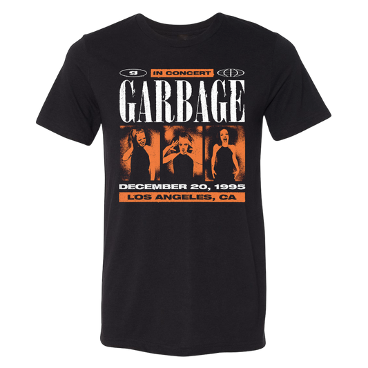 Black cotton t-shirt featuring a bold graphic of the band garbage with orange and white text announcing their december 20, 1995 concert in los angeles, ca.
