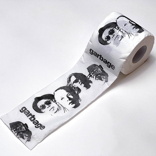 Roll of toilet paper printed with black and white portraits and the word ’garbage’.