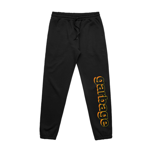 Black sweatpants with ’garbage’ printed in orange and yellow lettering on one leg.