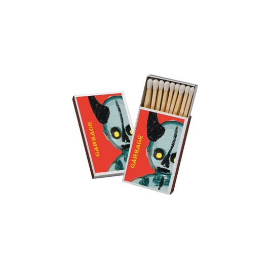 Matchboxes featuring a stylized alien or creature design on the cover.